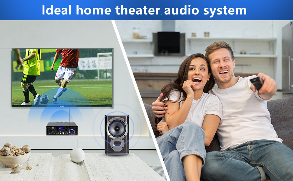 Home theater setup featuring large TV displaying soccer match, sound system with speakers, and receiver. Couch visible with snacks on table.