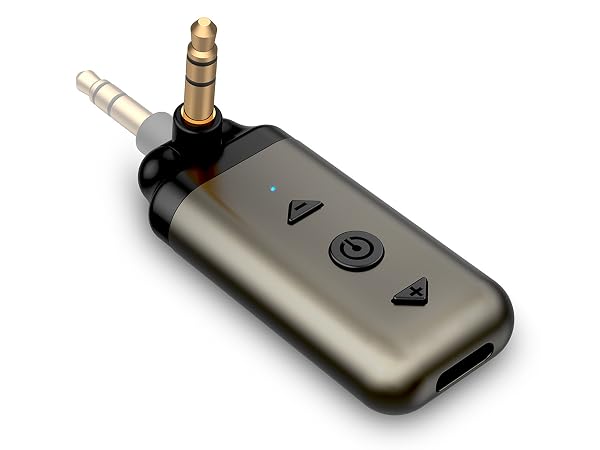 Compact silver audio device with 3.5mm jack, featuring volume and power buttons. Blue LED indicator light visible. Designed for portable use.