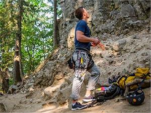 Photo of a climber looking up a canyon wall, preparing to begin their climb