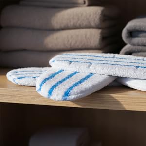 White and blue striped textile material shown from various angles on what appears to be a wooden surface.