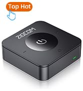 Small, square black electronic device with rounded corners. Features a central power button and 'Top Hot' label. Likely an audio or streaming device.