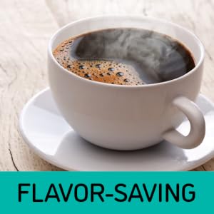 A steaming hot cup of coffee on a white mug and plate on top of a wooden table