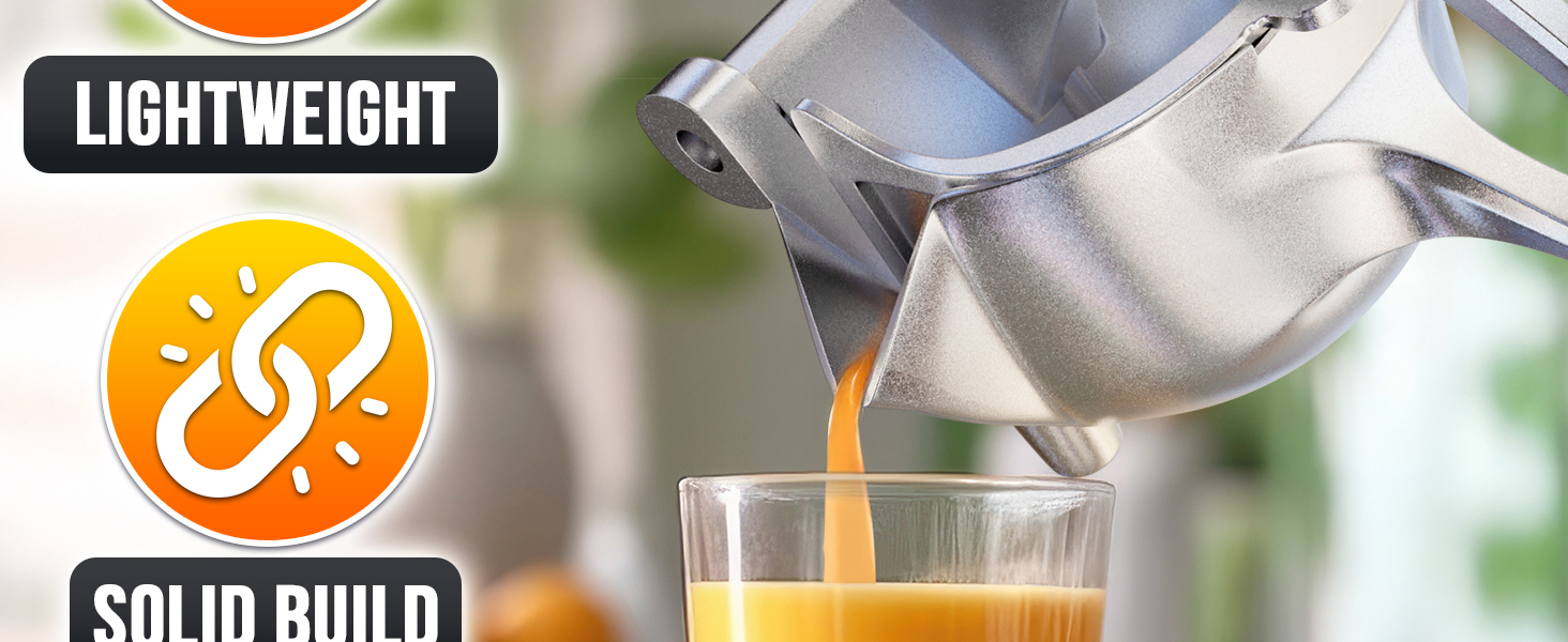 Fruit juice squeezer handheld presses citrus, pouring fresh juice from metal juicer into a glass