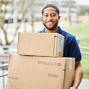 Delivery man holding boxes of McKesson products