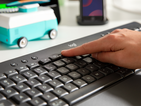 Zoom of hands typing on K650 keyboard in graphite