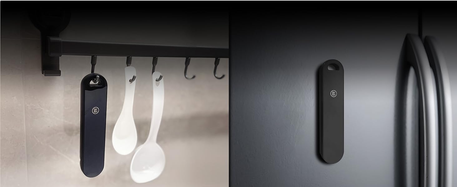 Black and white wall-mounted storage system with multiple hooks showing hanging items against a light background.