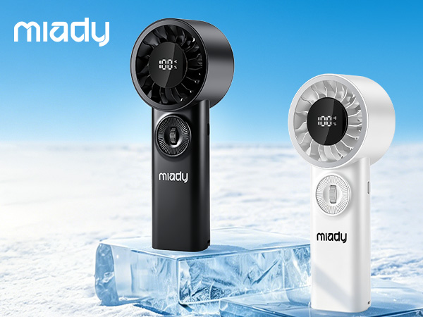 Text reads 'miady' (top left and bottom right). Two portable handheld fan models displayed—one black and one white—positioned on ice against blue sky background, highlighting compact cordless fan design.