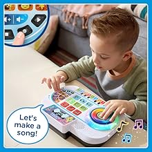 Kid presses record button to record his amazing song on the toy DJ Mixer. Toy: Let’s make a song!
