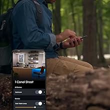 man controlling lights away from home through cync app