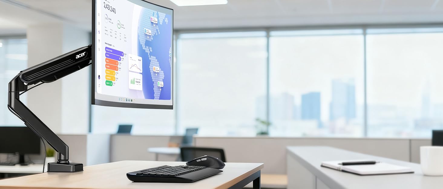 Modern office workspace setup showing multiple monitors, keyboard, and desk organization in a clean, minimalist environment with natural lighting.