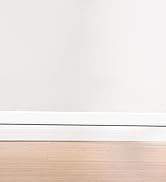 Modern office or commercial space interior showing large windows with installed horizontal blinds or shades providing natural light control.