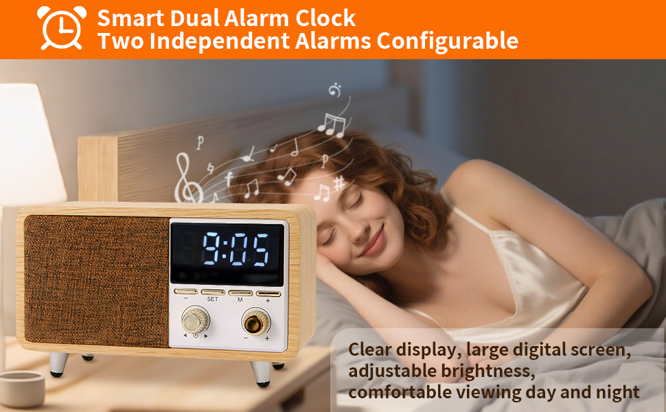 Person sleeping with dimmable LED alarm clock speaker on nightstand.