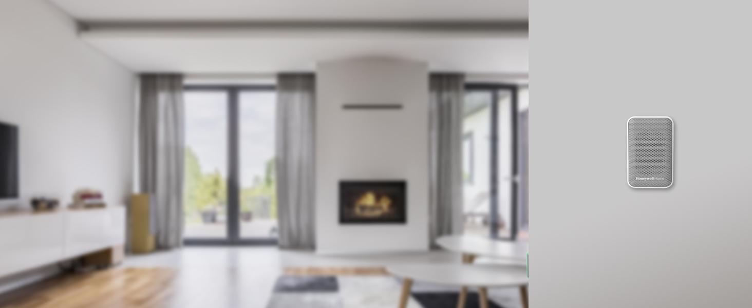 RDWL313P plugged into wall with a modern family room in the background.