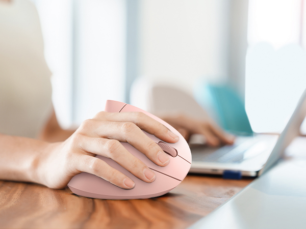 a woman's hand is on a mouse