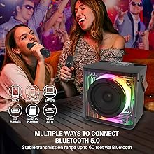 Two people singing with wireless microphones