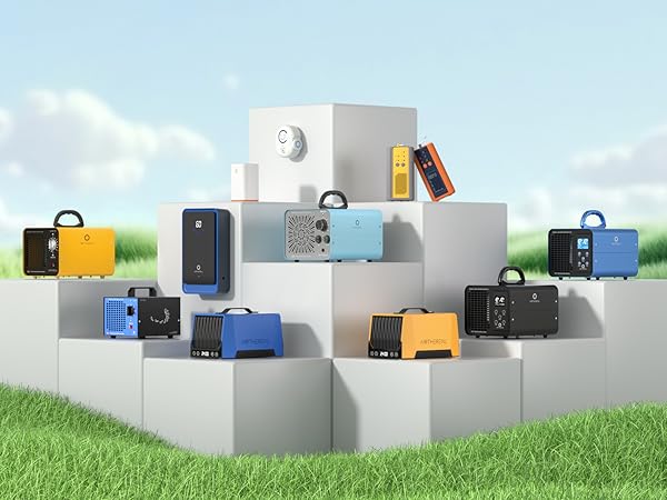 Product arrangement showing colorful electronic devices displayed on white geometric platforms against blue sky and grass background.