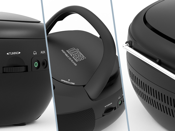 Black portable speaker with curved handle, multiple audio input ports, and vented design. Features 'Tuning' and 'AUX' labels near controls.