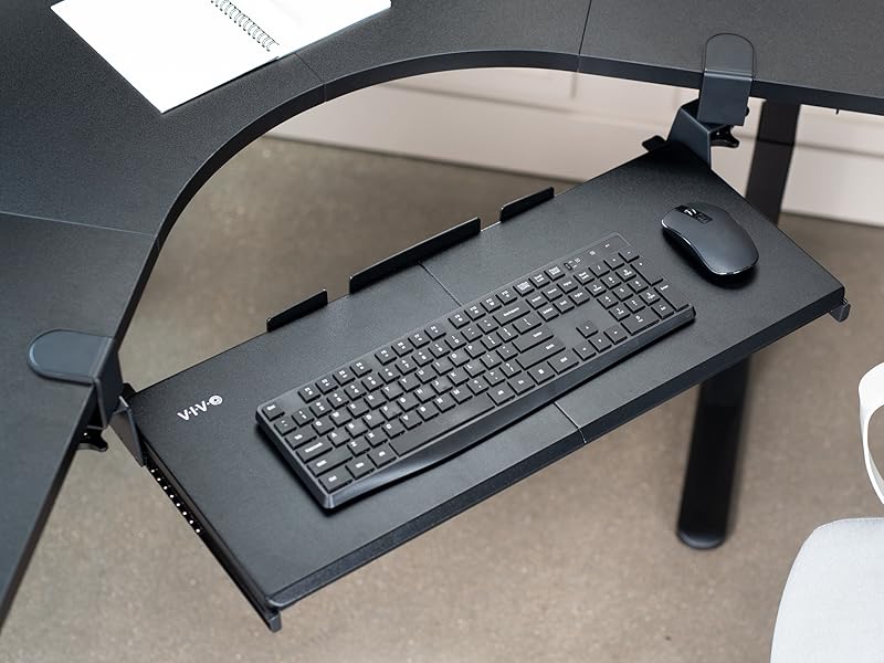 Overhead shot of corner desk keyboard tray