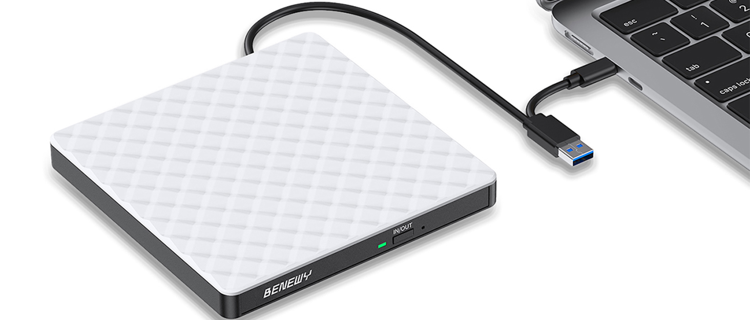 White textured external hard drive with black USB cable connected to laptop computer, shown at angle against white background.