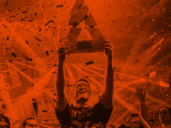 -SteelSeries sponsored player holding up trophy on esports stage with confetti