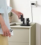 Charging dock with multiple device slots on a bedside table. Text reads 'READY-TO-USE ALWAYS FULLY CHARGED'. Hand placing device into dock.
