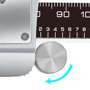 a close up of a metal measuring tape with a ruler