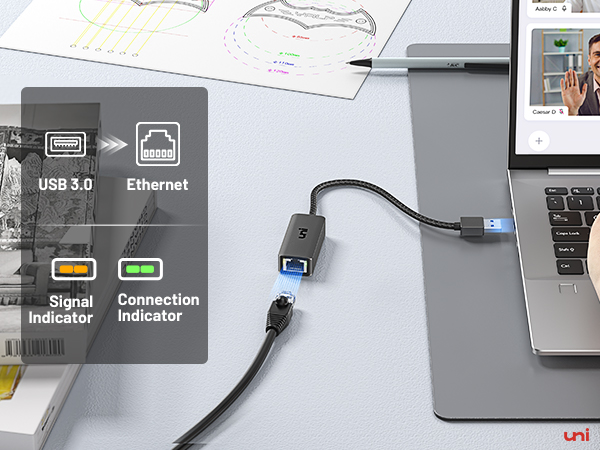 a laptop with a usb cable connected to it