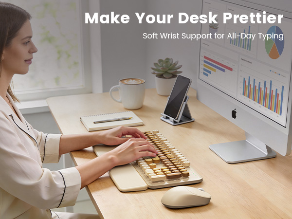 Woman typing on beige wireless keyboard mouse combo with wrist rest on tidy desk