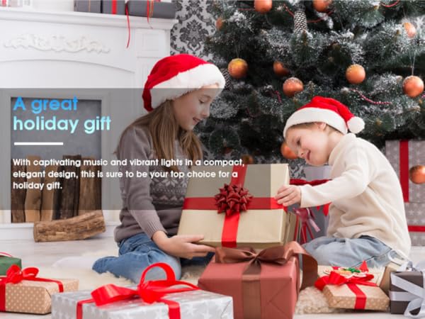 Text reads 'A great holiday gift'. Multiple connected images showing wrapped Christmas presents with red ribbons near decorated tree, creating a cohesive holiday gift presentation scene.