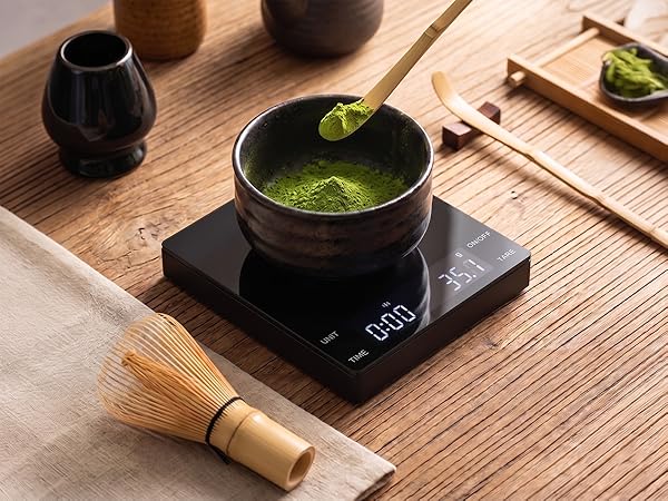 A small scale is weighing matcha.