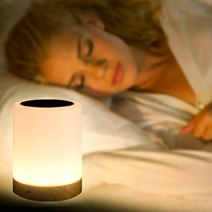 Peaceful sleeping woman with night light