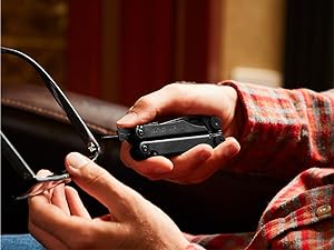 Photo of person fixing glasses with the Wave+ multi-tool