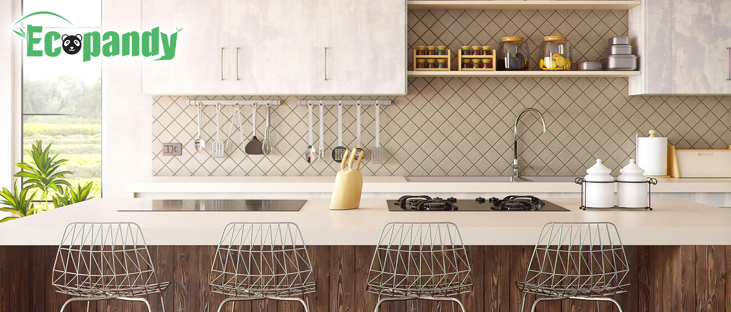 Modern kitchen interior with white upper cabinets, wooden lower cabinets, and a tiled backsplash. Four wire bar stools line the counter, and cooking utensils are visible.