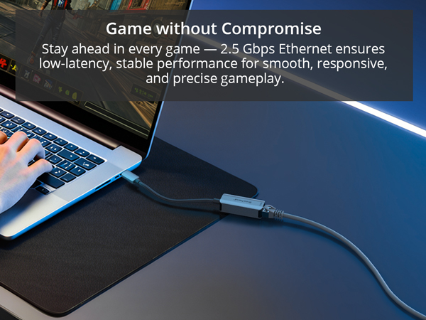 A Man Is Playing Online Game on a Laptop via USB-C to Ethernet Adapter