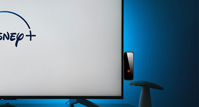 Bluetooth transmitter plugged into TV to stream audio wirelessly