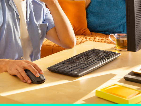a man using mk295 wireless keyboard and mouse combo
