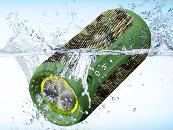 Waterproof portable speaker shown partially submerged. Cylindrical green device with mesh grille and yellow accent. Water splashing around it, demonstrating water resistance.