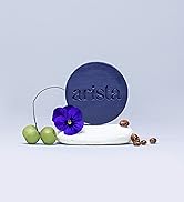 Arista’s natural ingredients purple shampoo bar balanced on natural stone