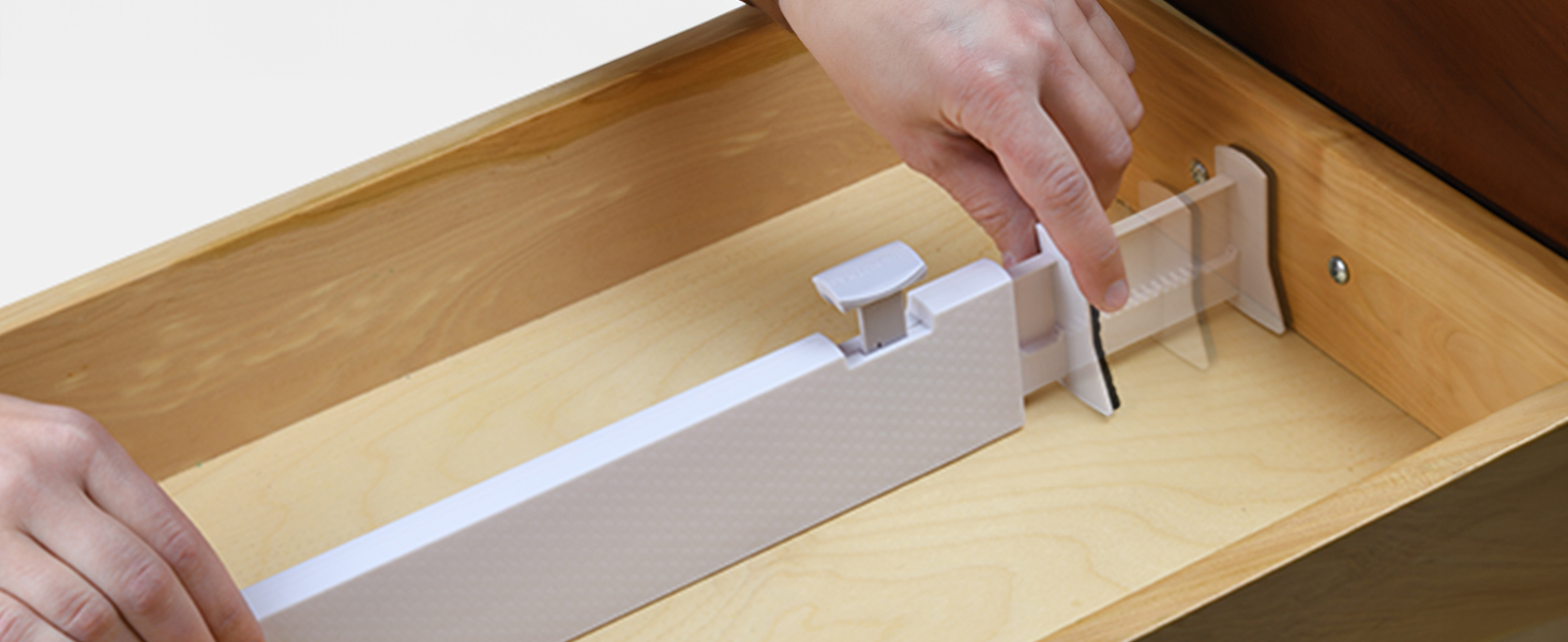 2b Image of the drawer dividers being adjusted and locked into place inside the drawers