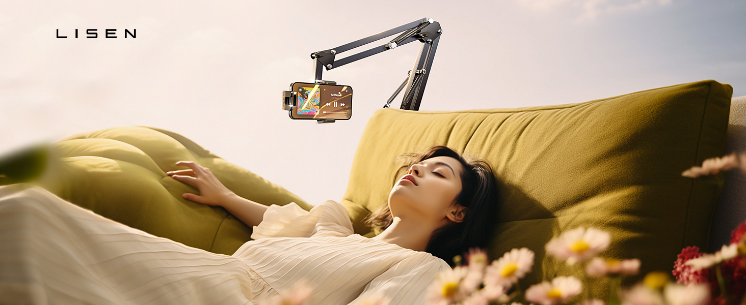 Adjustable phone mount arm attached near yellow couch, designed for overhead viewing while resting.