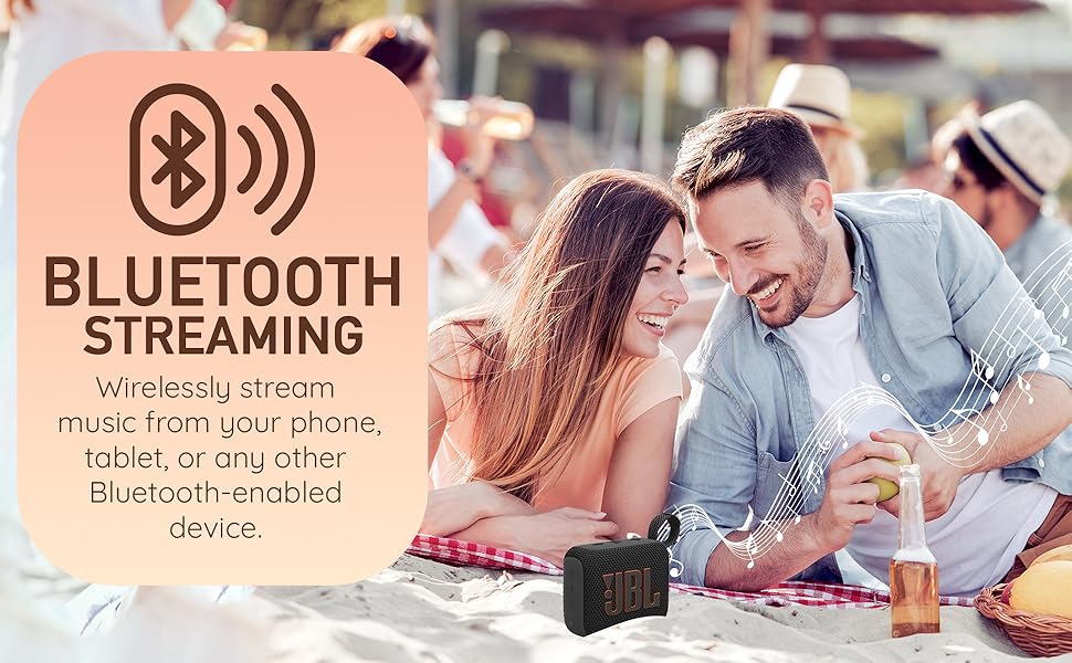 JBL portable speaker with a couple enjoying music on the beach, highlighting Bluetooth streaming.
