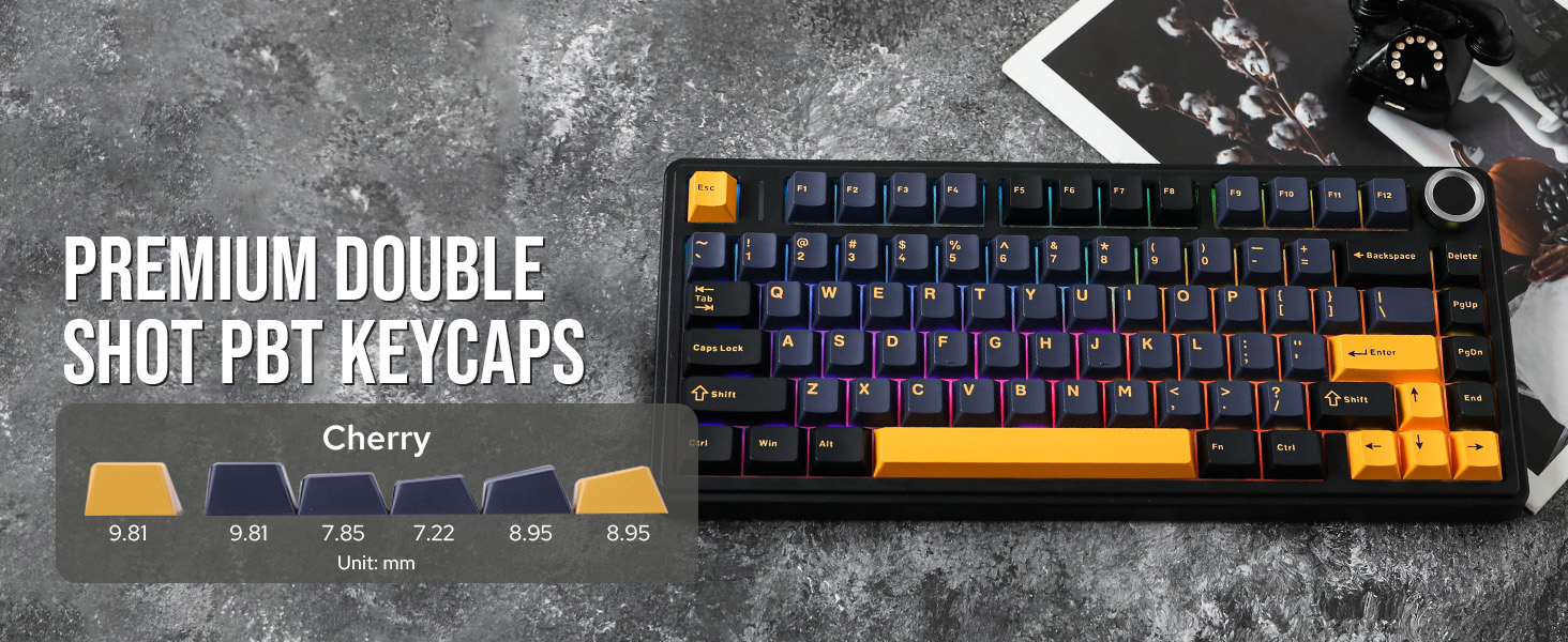 Mechanical keyboard with Premium Double Shot PBT keycaps featuring orange accent keys and blue LED backlight on a textured grey surface.