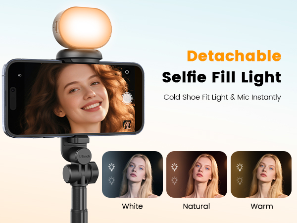 Detachable selfie fill light mounted on smartphone. Oval-shaped light with adjustable color temperatures: white, natural, and warm. Text reads "Detachable Selfie Fill Light" and "Cold Shoe Fit Light &amp; Mic Instantly".