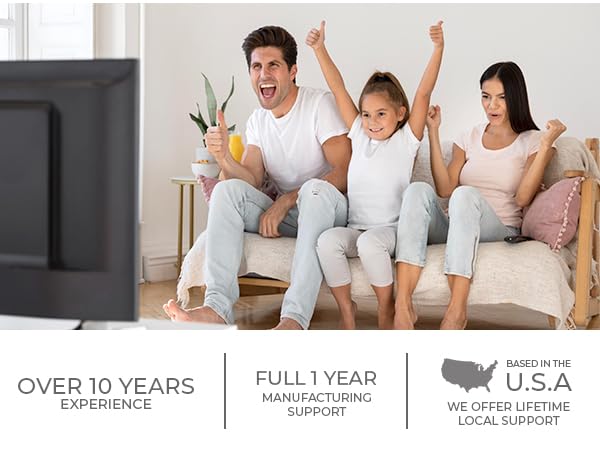 a family sitting on a couch watching tv