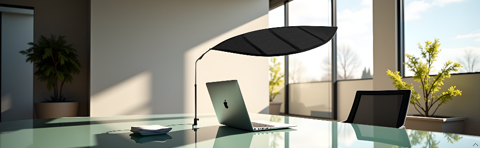 Laptop with TopShade sun shade on glass desk in bright office - blocks window glare