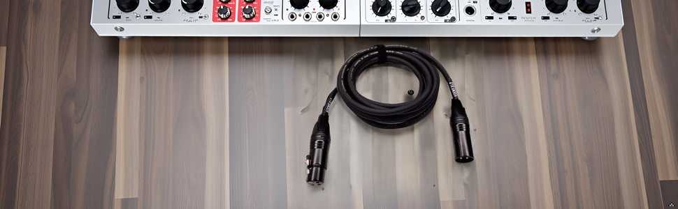 A sleek and modern recording studio setup with the product cable neatly organized and connected to v