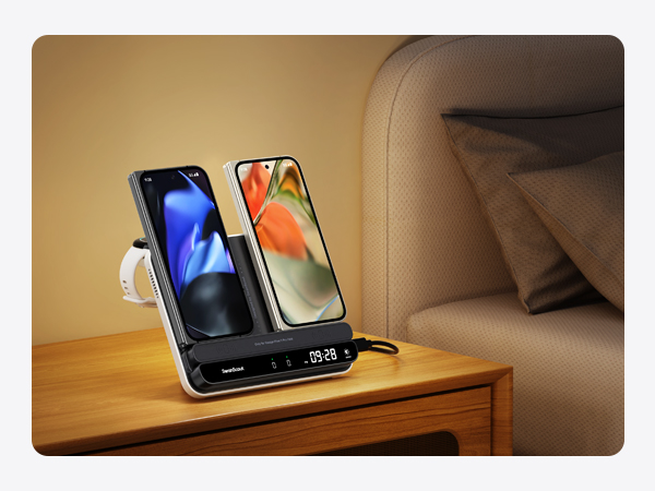 Dual phone charging station with digital clock display, showing two smartphones docked side-by-side on a nightstand.