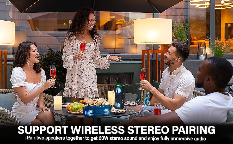 Speaker is playing on a table, at a dinner