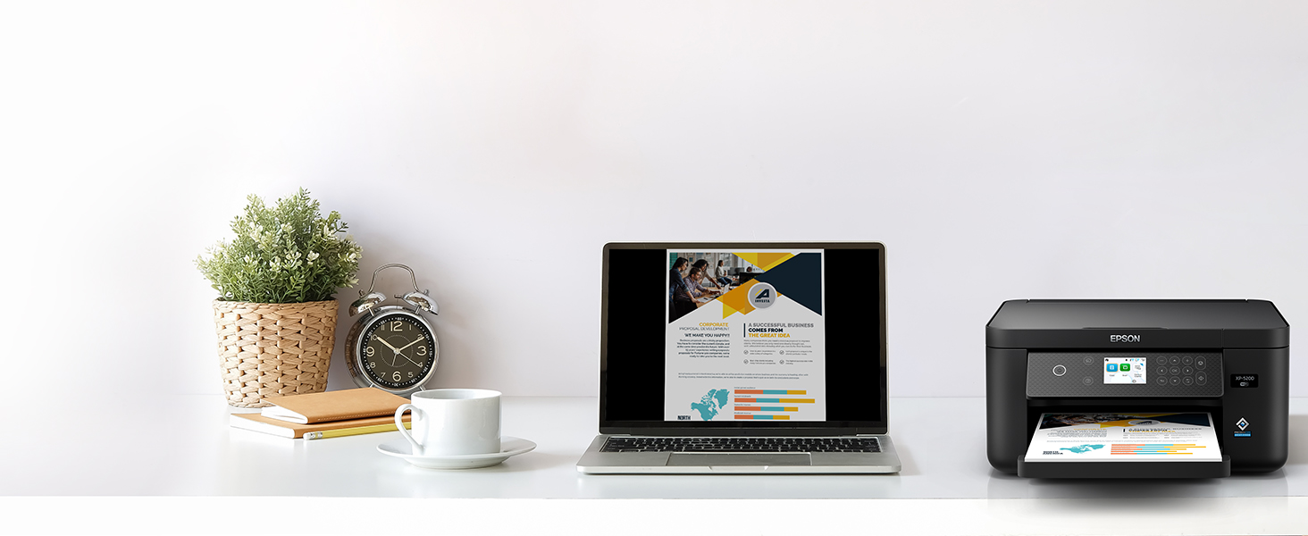 Black Expression Home XP-5200 on desk wirelessly printing content from laptop