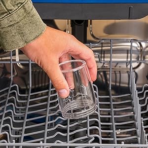 An Image of a hand placing the transparent spice container holder in a dishwasher to be cleaned
